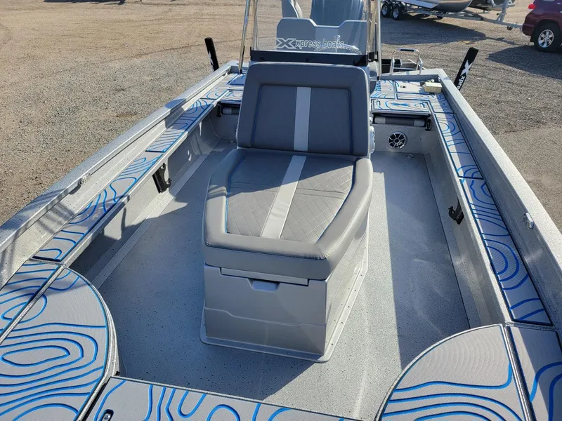 Slide: The Image of 2024 Xpress X23 Bay Lounge boat interior with stylish seating and modern design. - 15