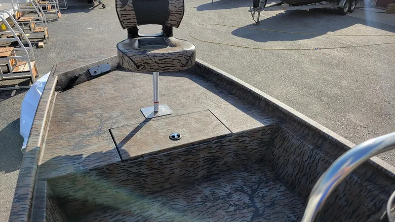 Slide: The Image of 2025 Xpress XP18CC center console boat with camo seating and deck, in stock. - 11