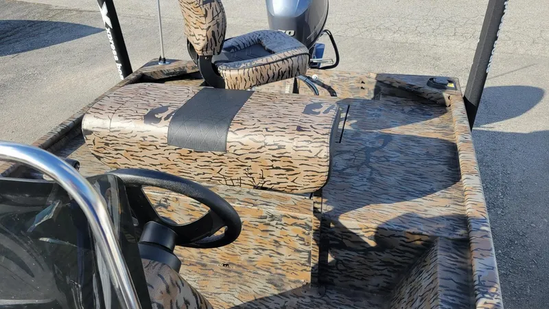 Slide: The Image of 2025 Xpress XP18CC center console boat with Yamaha 70 hp engine, camo design. - 12