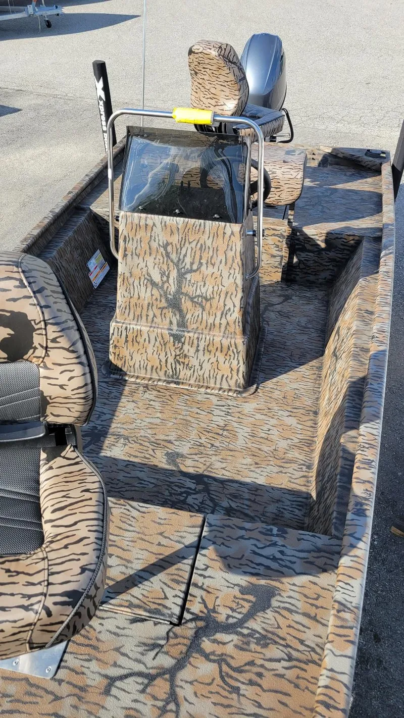 Slide: The Image of 2025 Xpress XP18CC boat with Yamaha 70 hp, camo design, center console. - 6