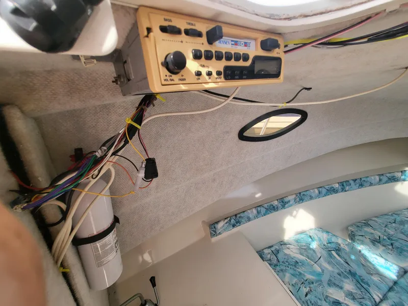 Slide: The Image of Interior of a 1998 Seaswirl 2300 Walkaround boat with radio and wiring. - 16