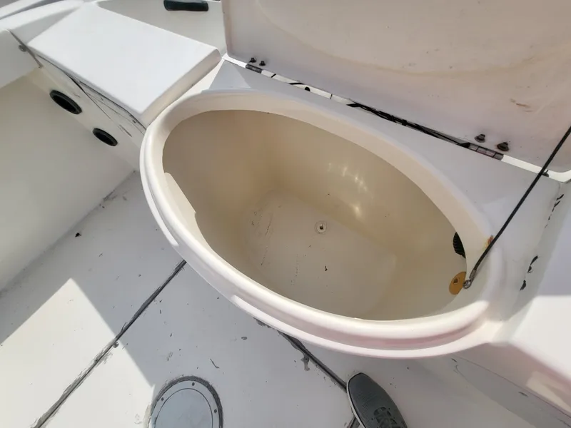 Slide: The Image of 1998 Seaswirl 2300 Walkaround boat interior with open storage compartment. - 20