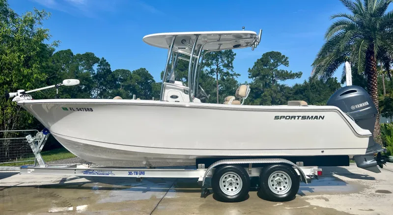 Slide: The Image of 2015 Sportsman 232 boat on a trailer with Yamaha outboard motor. - 0