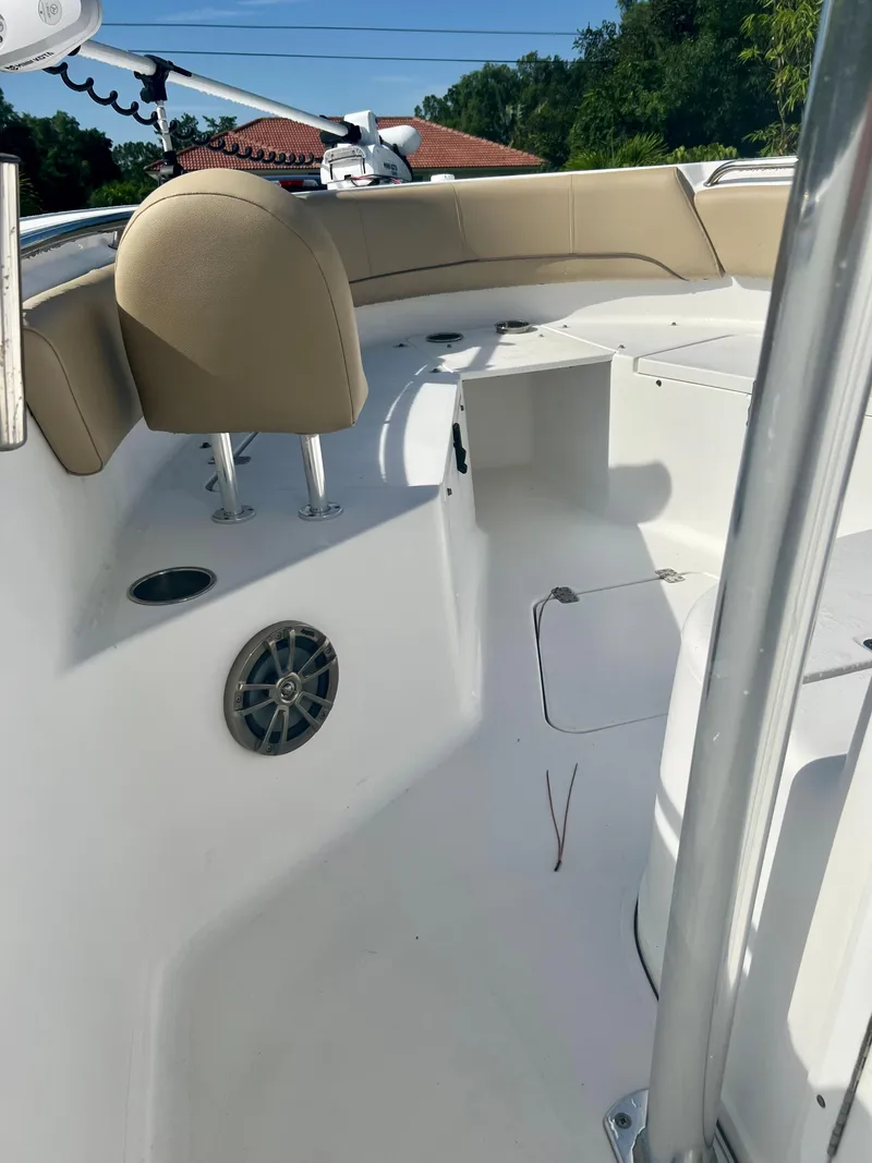 Slide: The Image of 2015 Sportsman 232 boat interior with seating and speaker. - 10