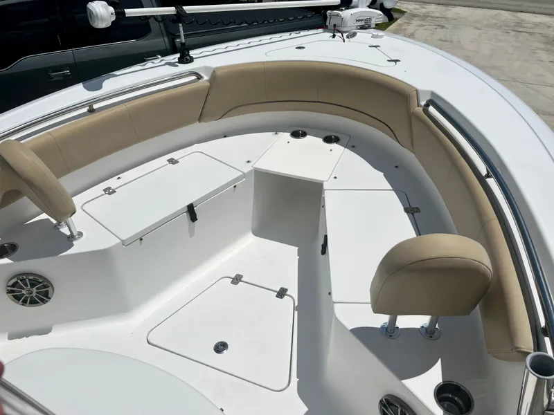Slide: The Image of 2015 Sportsman 232 boat with beige seating and storage compartments. - 11