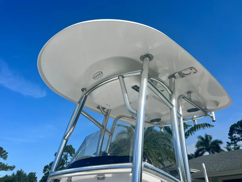 Slide: The Image of 2015 Sportsman 232 boat T-top against clear blue sky. - 16