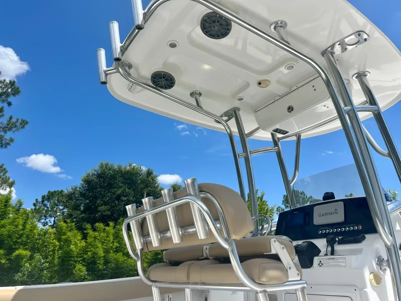 Slide: The Image of 2015 Sportsman 232 boat with T-top and Garmin navigation system. - 18