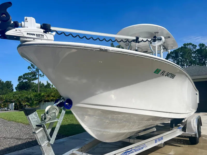 Slide: The Image of 2015 Sportsman 232 boat on trailer with Minn Kota trolling motor. - 2