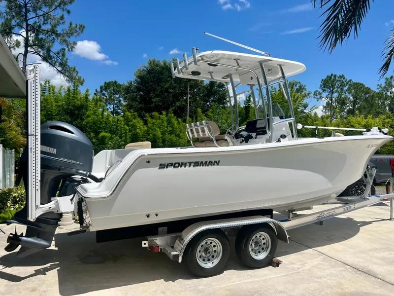 Slide: The Image of 2015 Sportsman 232 boat on a trailer with Yamaha outboard motor. - 27