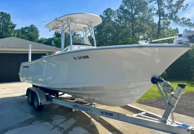 Slide: The Image of 2015 Sportsman 232 boat on trailer in driveway, ready for transport. - 6