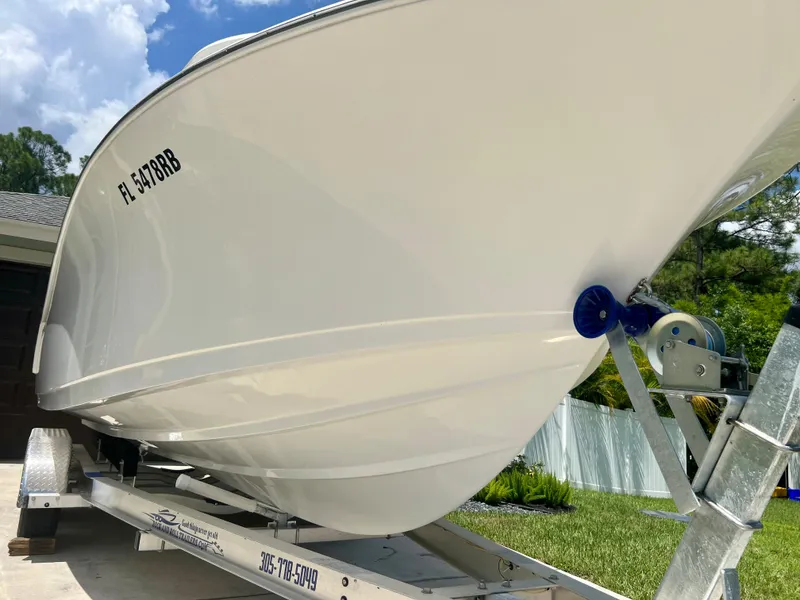 Slide: The Image of 2015 Sportsman 232 boat on trailer, side view. - 8