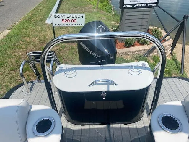 Slide: The Image of 2023 Avalon Catalina 2385 Quad Lounger boat with Mercury engine at dock. - 14