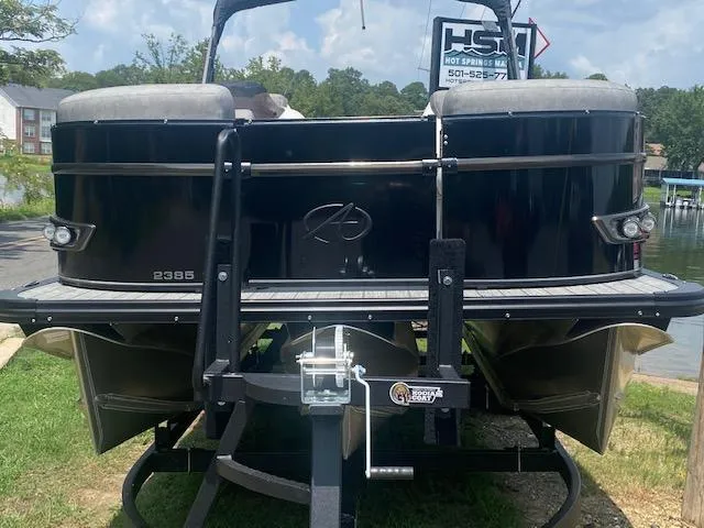 Slide: The Image of 2023 Avalon Catalina 2385 Quad Lounger pontoon boat on trailer. - 2