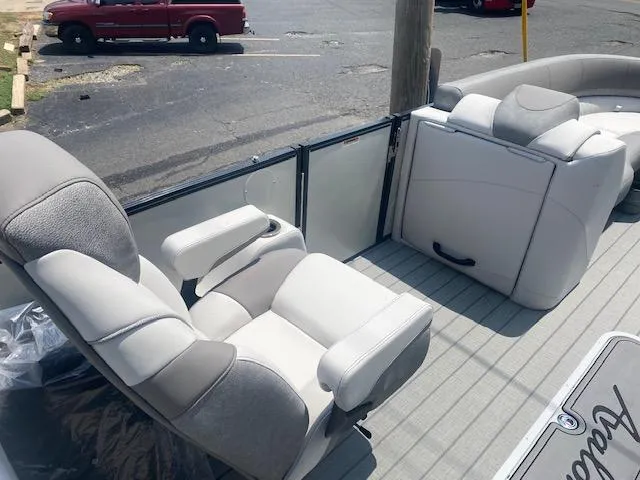 Slide: The Image of 2023 Avalon Catalina 2385 Quad Lounger interior with plush seating and armrests. - 20