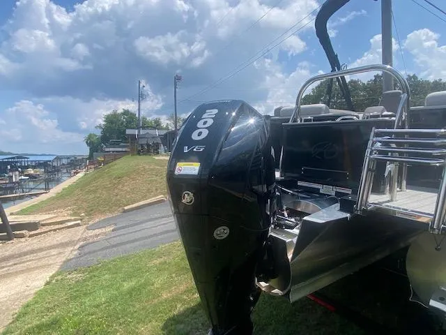 Slide: The Image of 2023 Avalon Catalina 2385 Quad Lounger with 200 V6 engine at lakeside. - 5