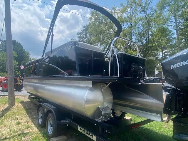 Slide: The Image of 2023 Avalon Catalina 2385 Quad Lounger pontoon boat on a trailer. - 6