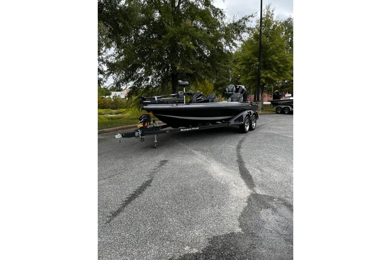 The Image of 2024 Ranger Z520R Ranger Cup Equipped boat on trailer in parking lot. - 1