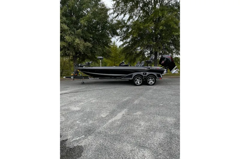 Slide: The Image of 2024 Ranger Z520R Ranger Cup Equipped boat on trailer, parked outdoors. - 2