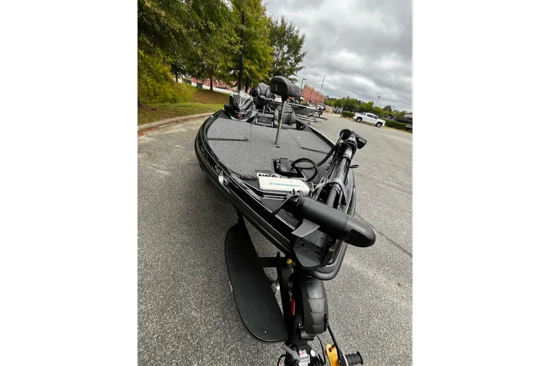 Slide: The Image of 2024 Ranger Z520R Ranger Cup Equipped boat parked outdoors on a cloudy day. - 7