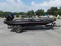 The Image of 2024 Ranger RT178C fishing boat on trailer in parking lot. - 0