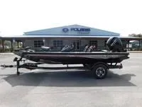 Slide: The Image of 2024 Ranger RT178C fishing boat parked outside dealership. - 4