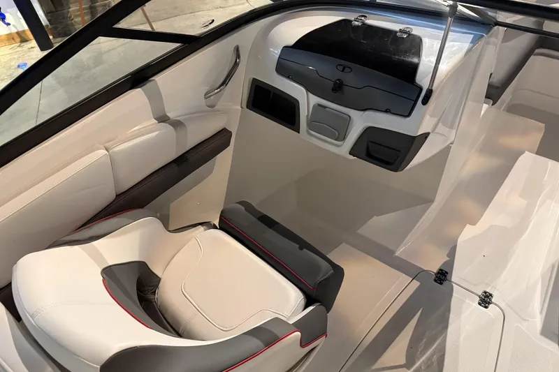 Slide: The Image of 2024 Tahoe 210 S boat interior with modern seating and sleek dashboard design. - 3