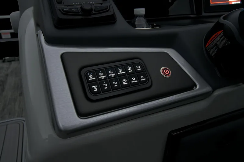 Slide: The Image of 2024 Ranger Reata 223F control panel with illuminated buttons and power switch. - 38