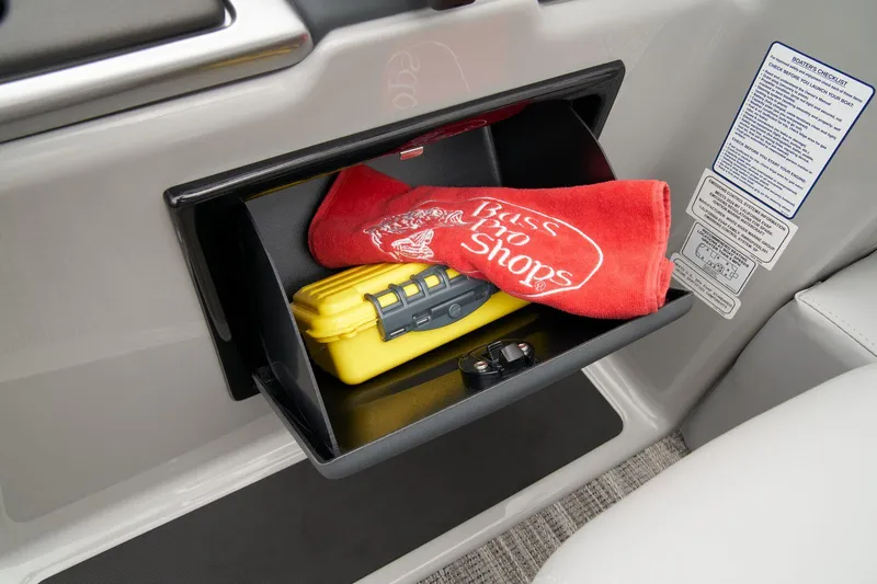 Slide: The Image of Storage compartment in 2024 Ranger Reata 223F with towel and yellow case. - 42