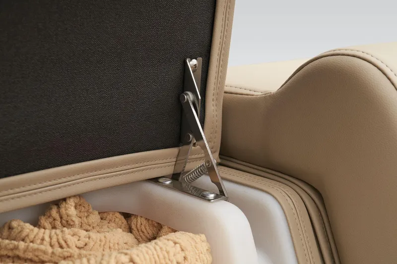 Slide: The Image of 2024 Regency 250 DL3 storage compartment with beige upholstery and metal hinge. - 25