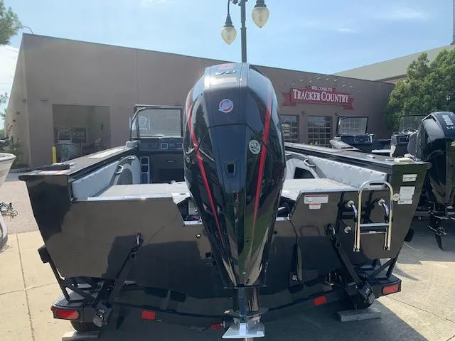 Slide: The Image of 2024 Ranger VX1888 WT boat displayed at Tracker Country dealership. - 18