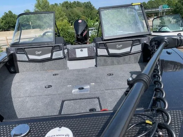Slide: The Image of 2024 Ranger VX1888 WT fishing boat interior with dual consoles and motor. - 9