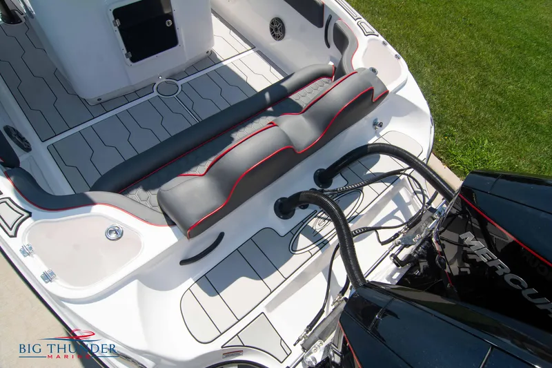 Slide: The Image of 2024 Glasstream 28 GSX Pro boat interior with seating and Mercury engine. - 9