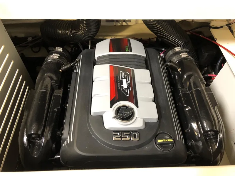 Slide: The Image of 2023 Sea Ray SPX 210 boat engine compartment with 4.5L 250 HP engine. - 12