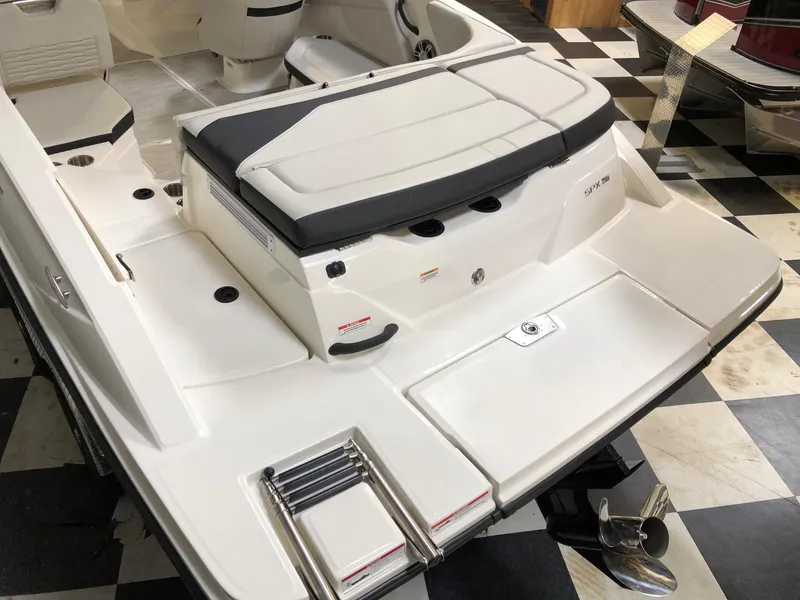 Slide: The Image of 2023 Sea Ray SPX 210 boat stern with swim platform and ladder. - 2