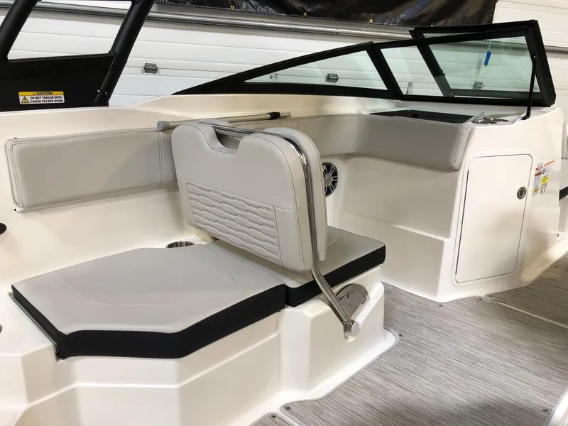 Slide: The Image of 2023 Sea Ray SPX 210 boat interior with white and black seating. - 5