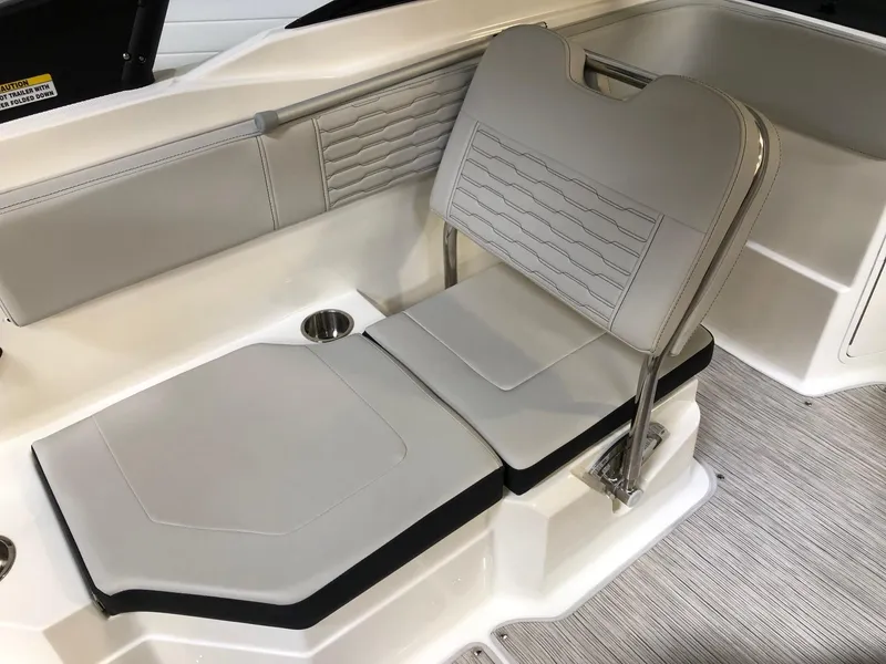 Slide: The Image of 2023 Sea Ray SPX 210 boat interior seating with cup holder. - 6