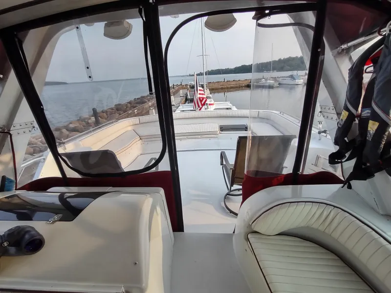 Slide: The Image of Interior view of a 1991 Bluewater Coastal Cruiser boat docked at a marina. - 16