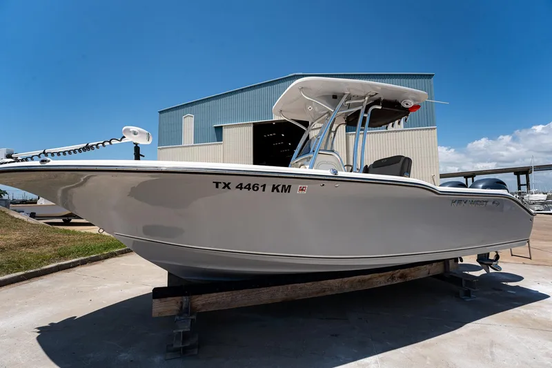Slide: The Image of 2021 Key West 244 Center Console boat on display outdoors. - 14