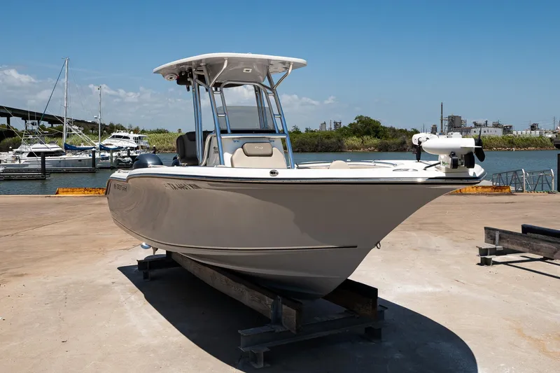Slide: The Image of 2021 Key West 244 Center Console boat on dock, marina background. - 16