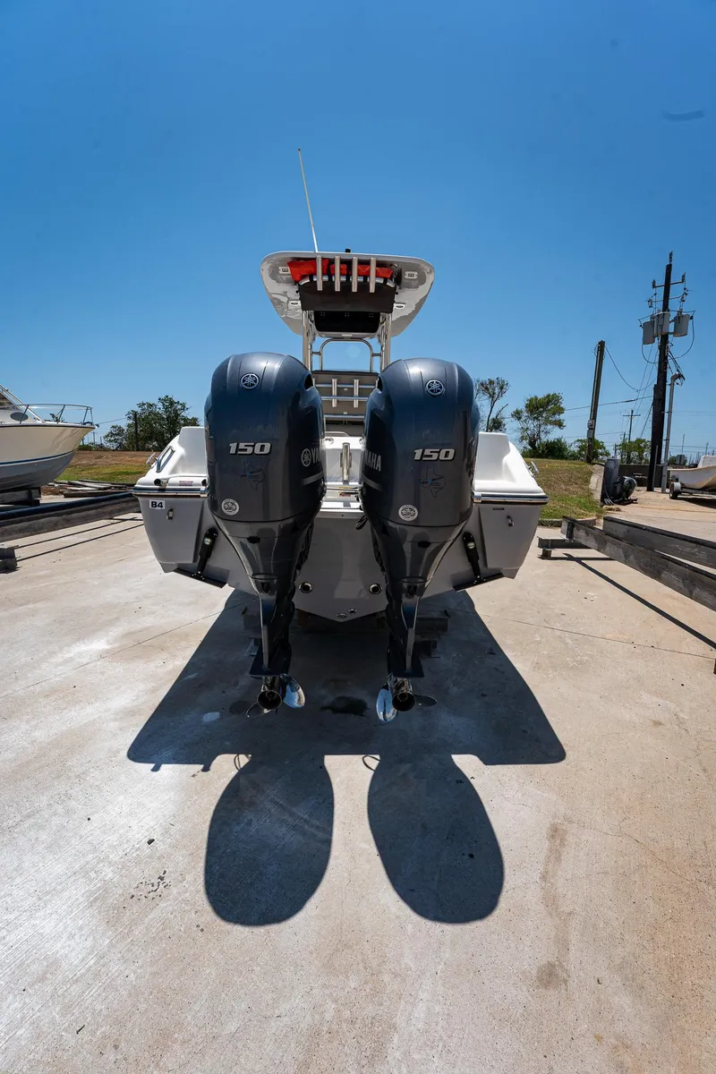 Slide: The Image of 2021 Key West 244 Center Console boat with dual 150 horsepower engines. - 22