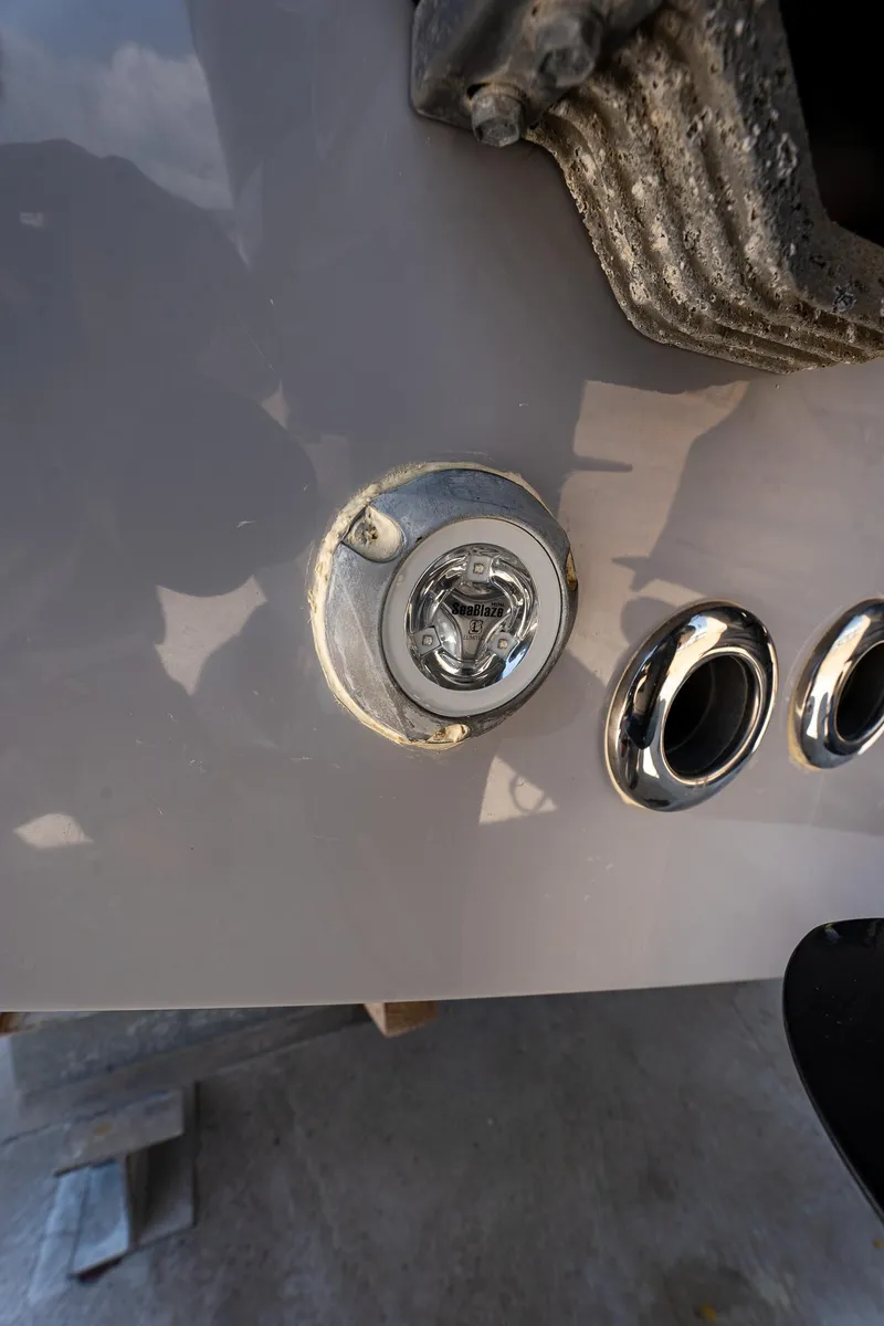 Slide: The Image of Close-up of 2021 Key West 244 Center Console boat exhaust and light. - 24