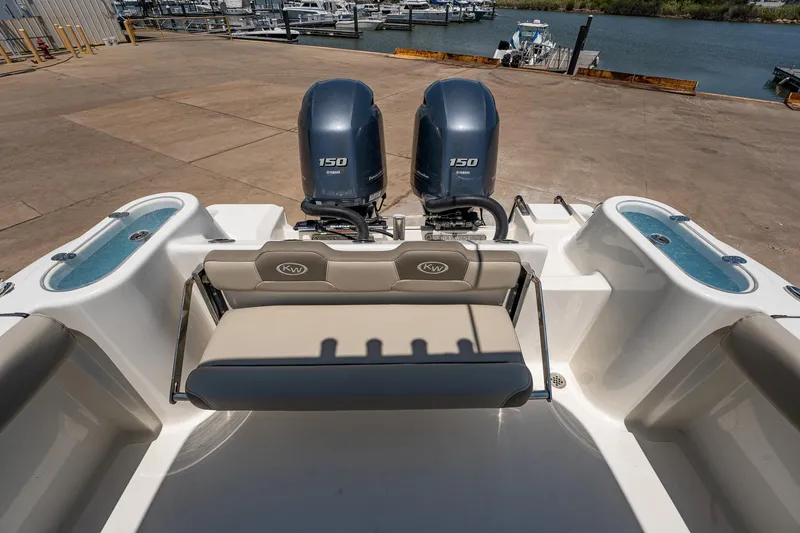 Slide: The Image of 2021 Key West 244 Center Console boat with twin 150 engines at dock. - 30
