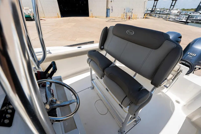 Slide: The Image of 2021 Key West 244 Center Console boat interior with dual seating and steering wheel. - 31