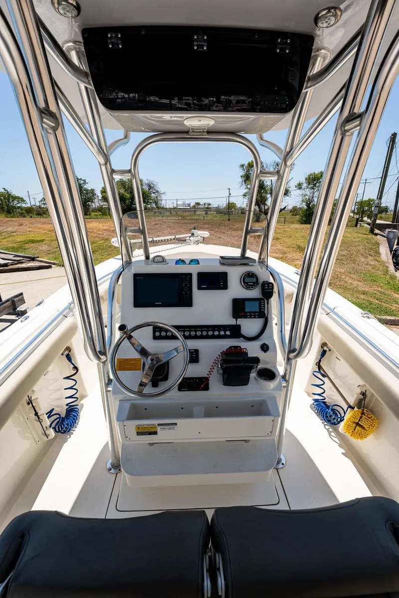 Slide: The Image of 2021 Key West 244 Center Console boat interior with steering wheel and control panel. - 33