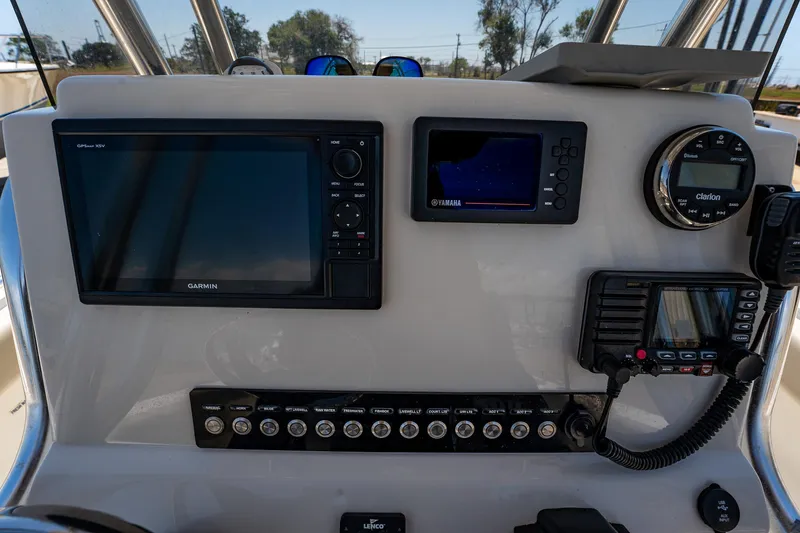 Slide: The Image of Dashboard of 2021 Key West 244 Center Console with navigation and control systems. - 35