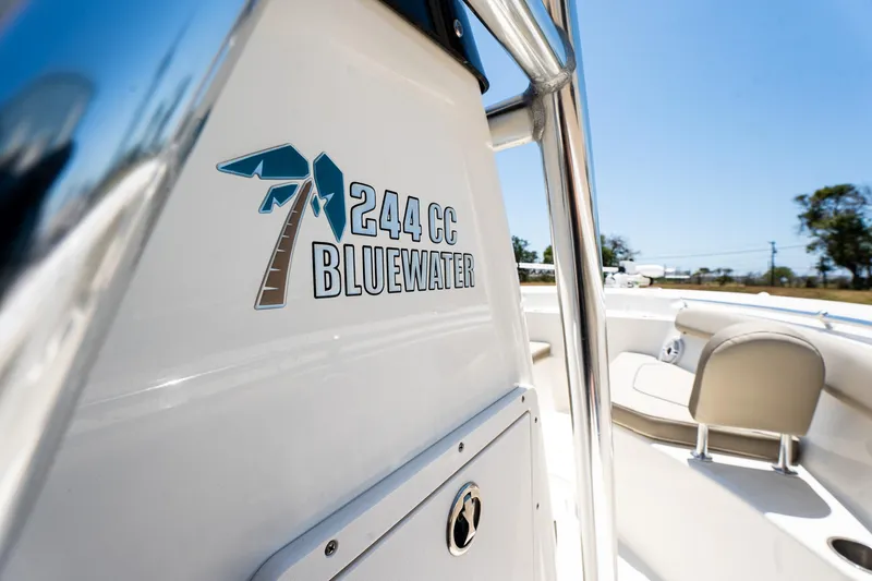 Slide: The Image of 2021 Key West 244 Center Console boat, close-up of Bluewater logo and seating. - 37