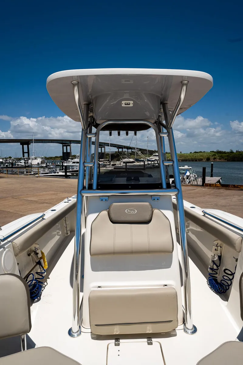 Slide: The Image of 2021 Key West 244 Center Console boat docked under clear blue sky. - 45