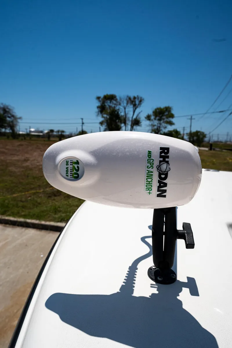 Slide: The Image of Rod holder on 2021 Key West 244 Center Console boat under clear blue sky. - 47