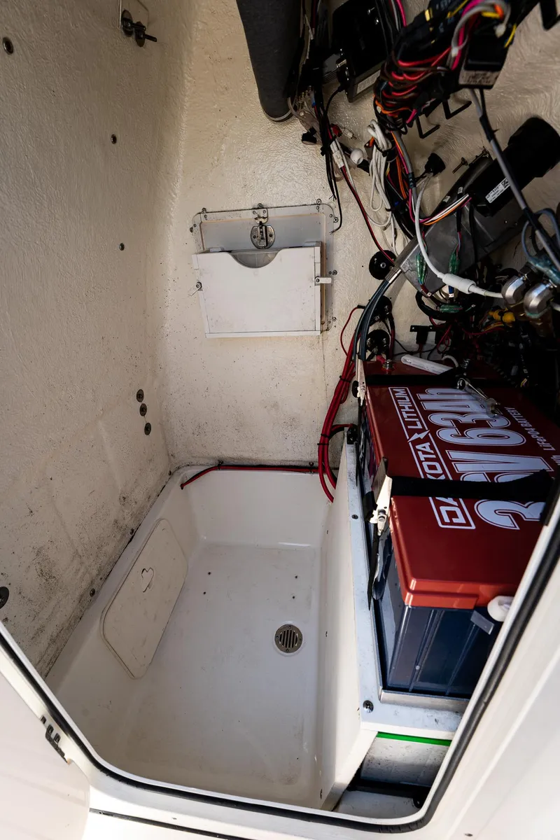 Slide: The Image of 2021 Key West 244 Center Console boat interior with battery and wiring. - 49
