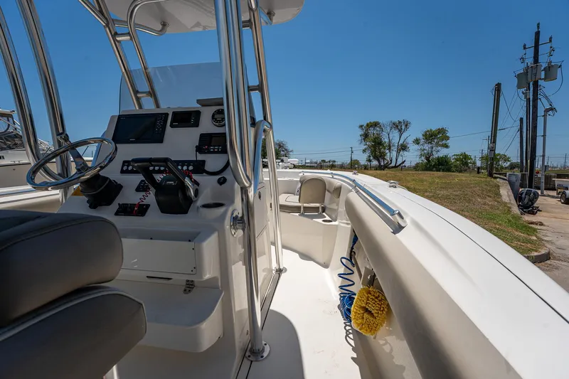 Slide: The Image of 2021 Key West 244 Center Console boat interior with steering wheel and controls. - 39
